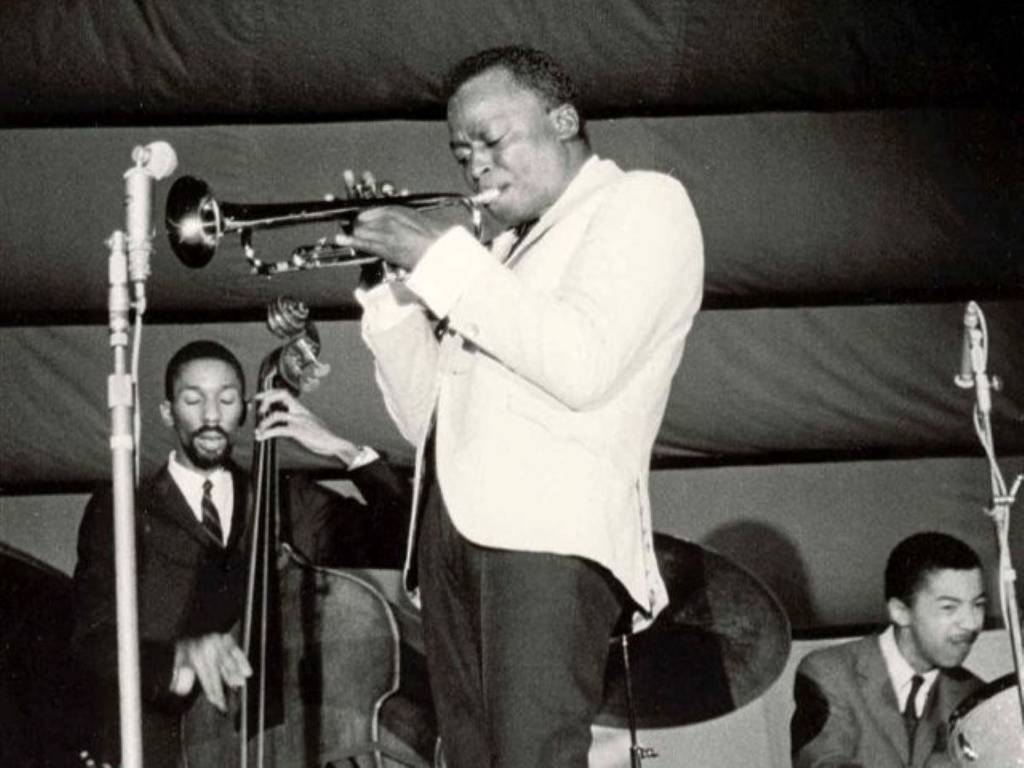 miles davis performs trumpet live on stage