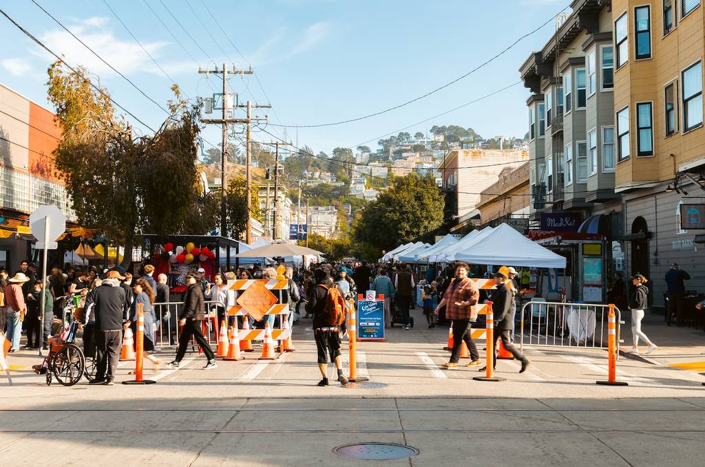 people walking in front of a night market
