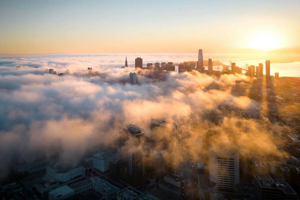 Fog at sunset over San Francisco skyline.