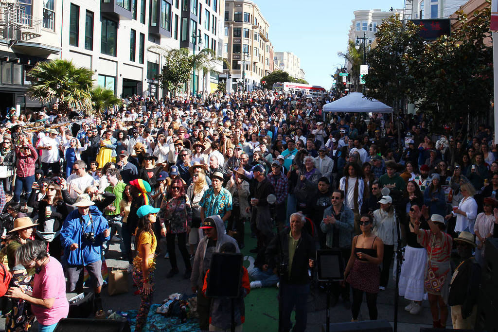 a crowd of people in a block party