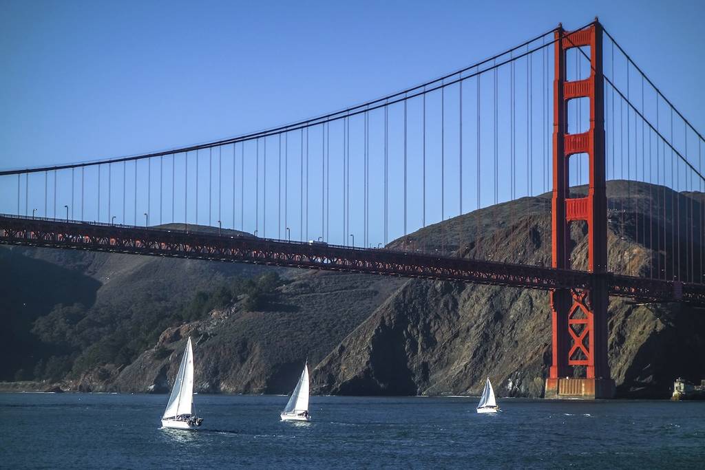 boats in front of the golden gate bridge