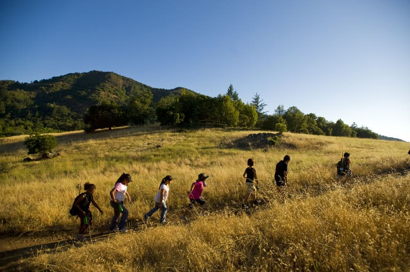 People walk on trail at Sugarloaf Ridge.