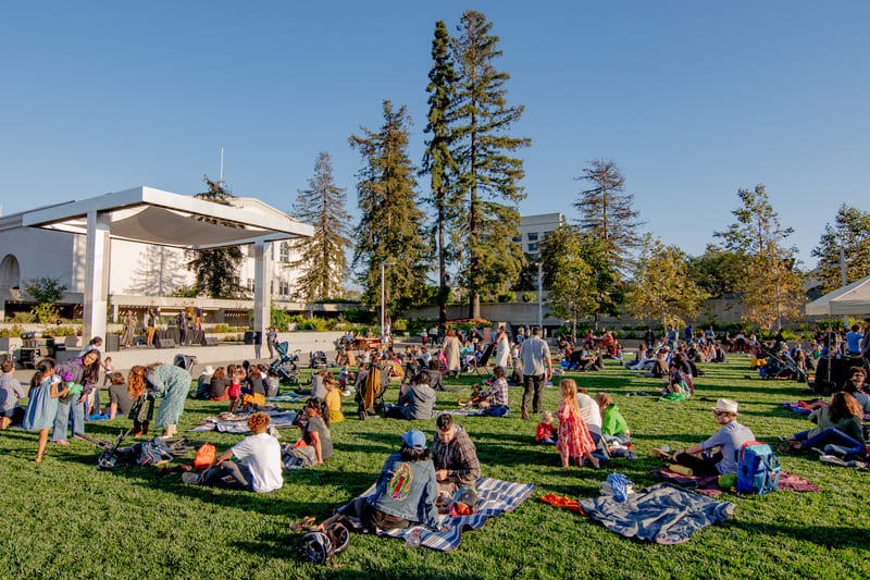 People congregate on the grass at OMCA Friday nights.