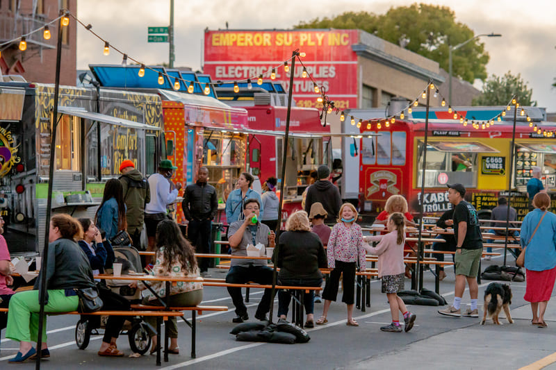 People congregate outside food trucks at OMCA Friday nights.