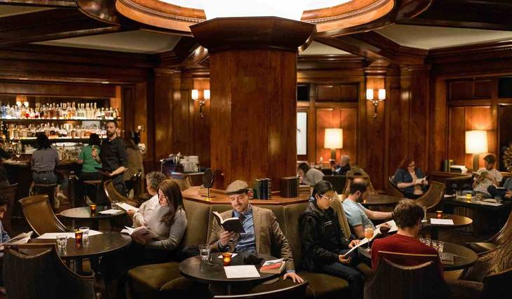 The Top 10 Places To Read A Book In Seattle, From A Cozy Fireside Room To A Hidden Library At Pike Place Market