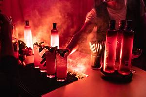 A bartender serves drinks