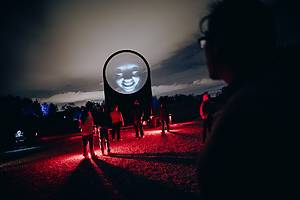 Guests navigate the spooky grounds at Forest of Shadows