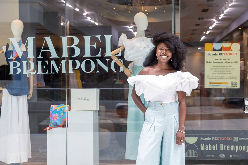A woman stands outside of the Mabel Brempong pop-up