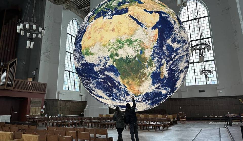 You Only Have A Few Days Left To See This Glowing 24-Foot Earth Floating In A Seattle Cathedral