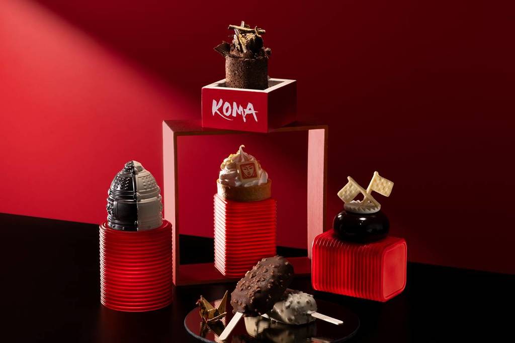 An image of desserts from Koma arranged in front of a red backdrop.