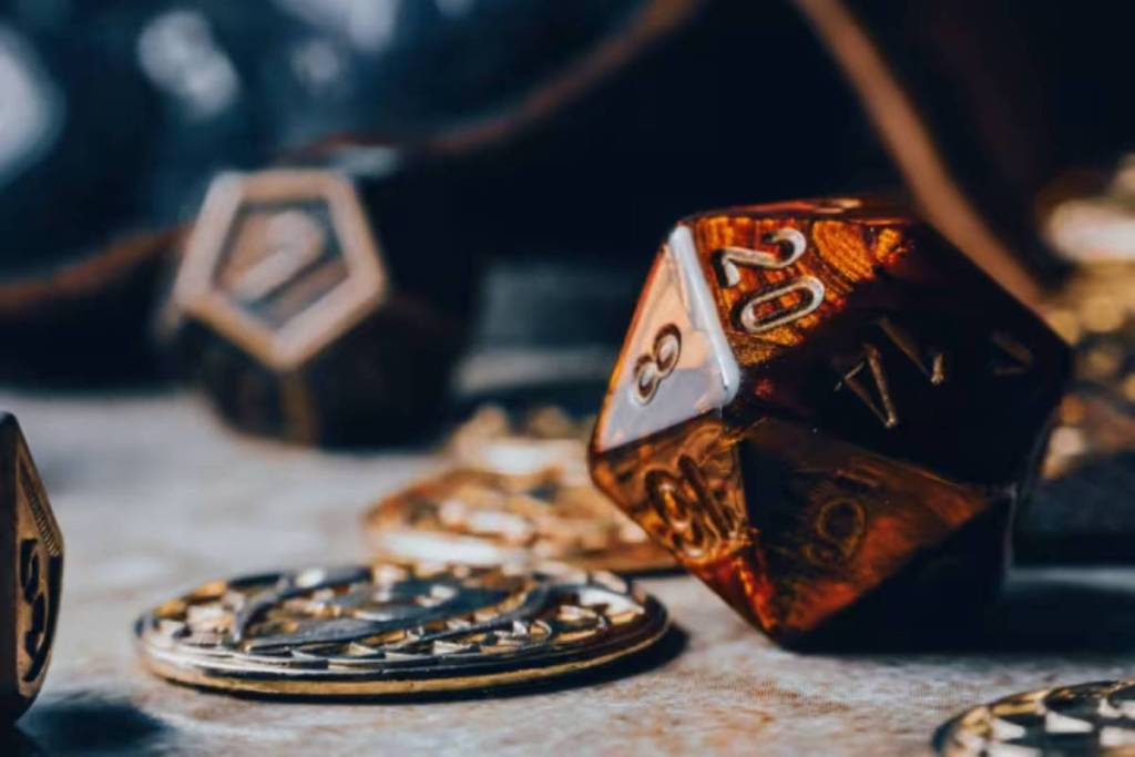 Portals Game Night tabletop featuring a D20 dice and tokens. One of the best things to do this July.