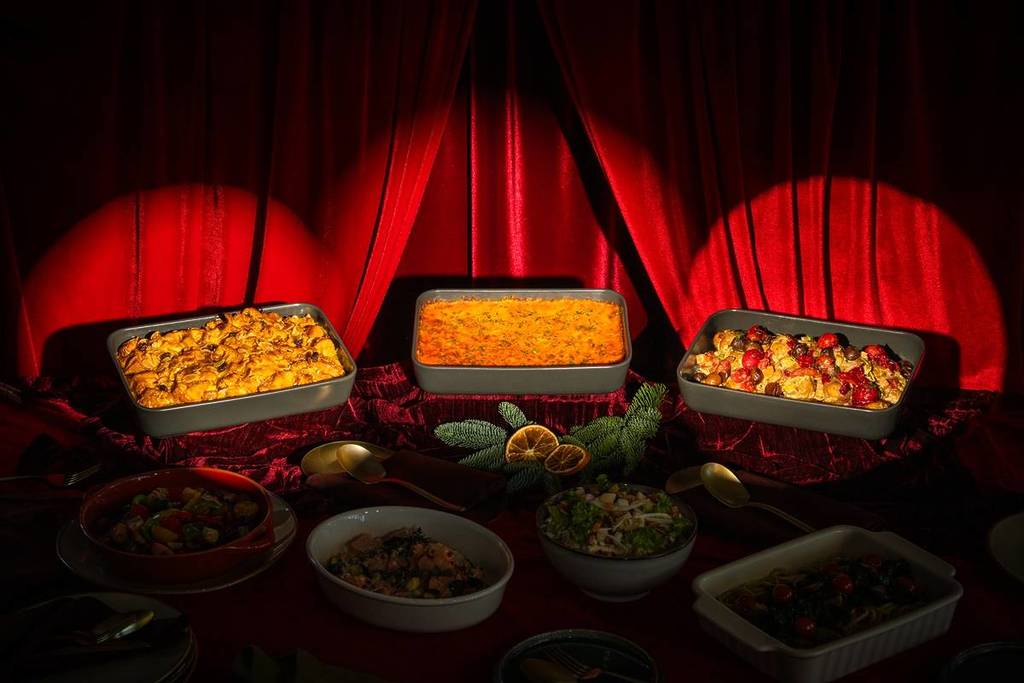 A view of Grain's Christmas buffet offerings, with a red curtain as the backdrop.