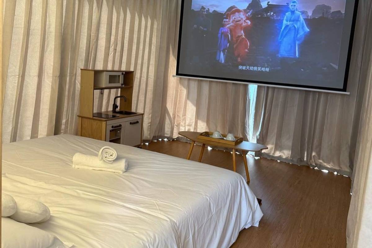 movie projector in bedroom at staycation