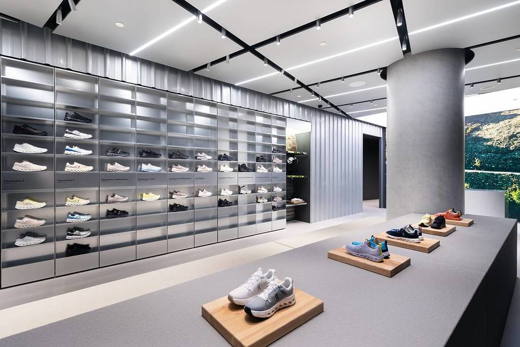 An interior view of the new On Singapore store, looking at the Magic Wall of shoes.
