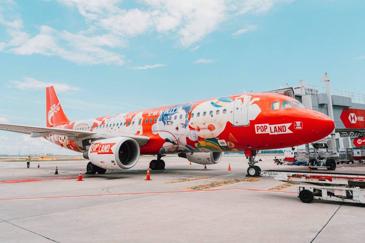 red POP Mart plane on the tarmac