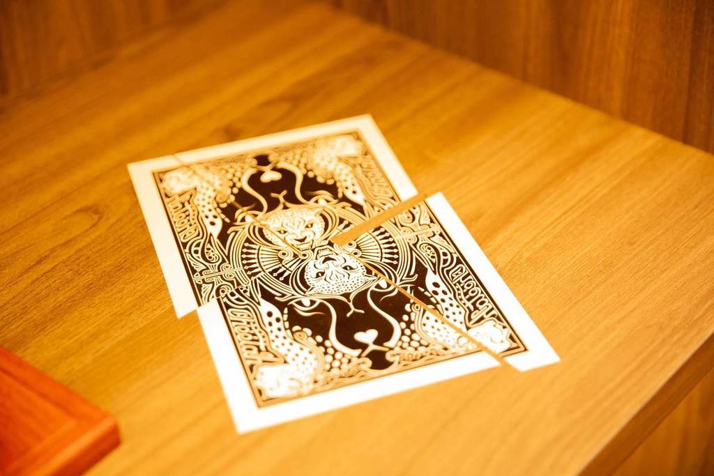 A playing card split in three as part of The Magic Attic's many tricks