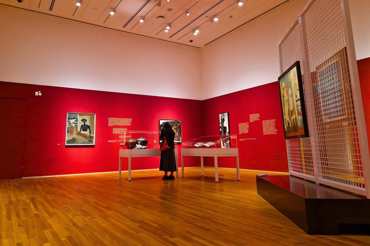 girl looks at art at National Gallery Singapore