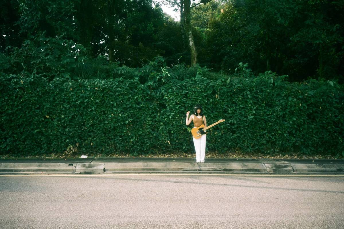 Jaie, standing along a roadside