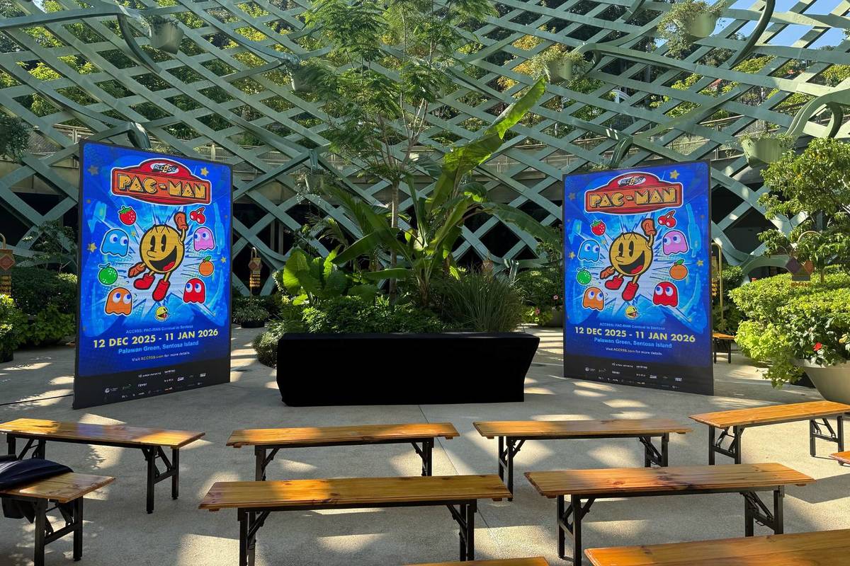 Benches and posters promoting the PAC-MAN Carnival in Sentosa Christmas 2025