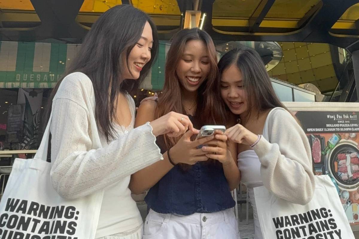 Three friends using clues to solve the riddles and uncover secrets behind HIDDEN Holland Village