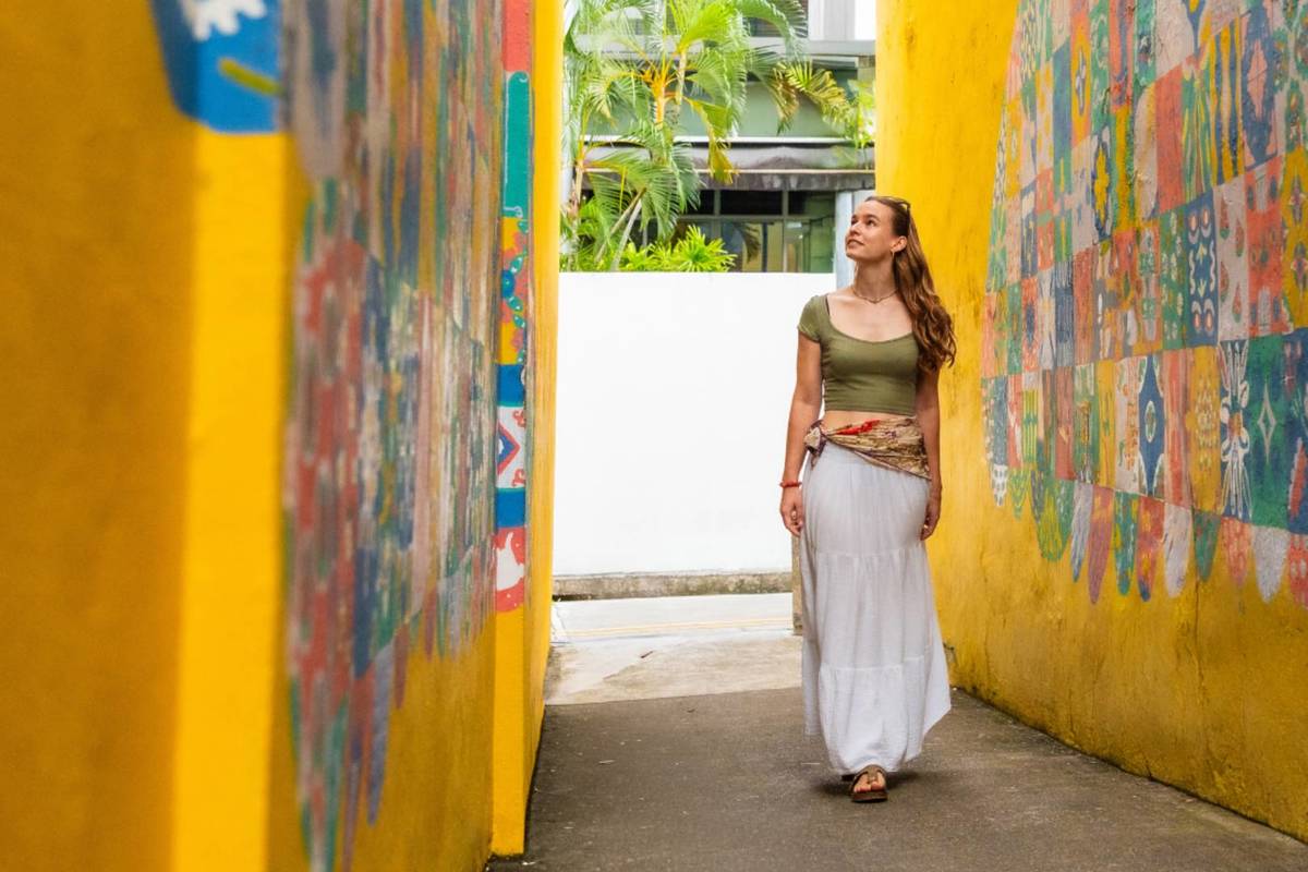 A woman wandering the streets exploring MONOPOLY: HIDDEN Singapore - Katong-Joo Chiat