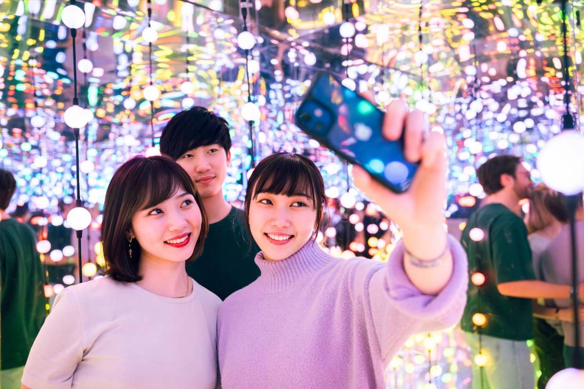A group of guests taking a selfie in the Cosmic Oasis at Dopamine Land