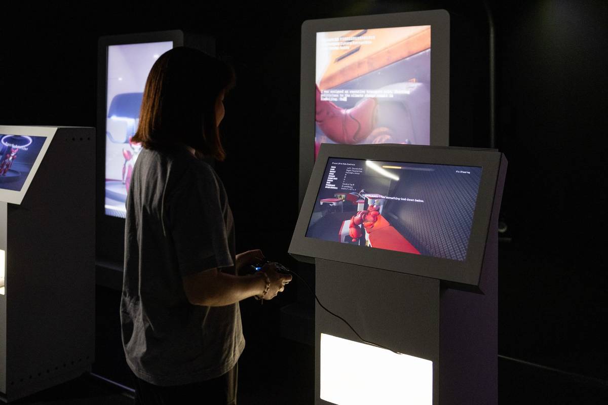 woman plays at new exhibition about AI in Singapore