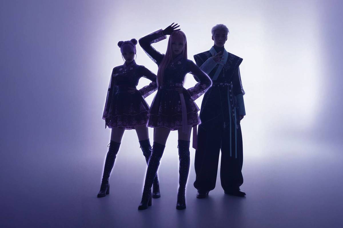 3 K-Pop artists striking a pose