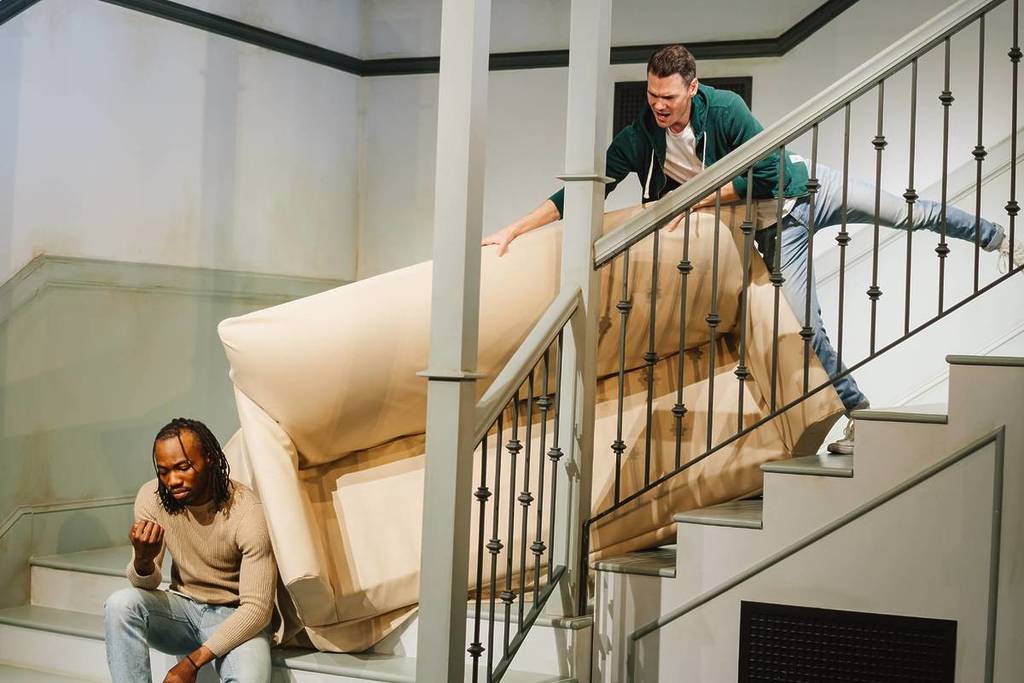 Guests recreating the unforgettable "Pivot" scene at The FRIENDS™ Experience - The One In Singapore