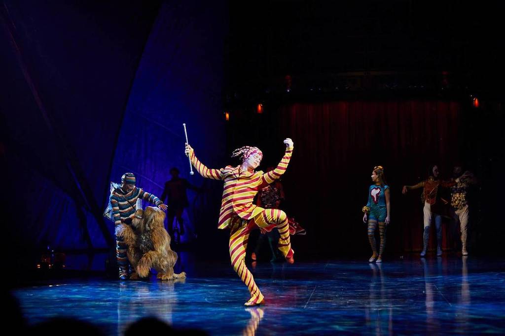 The Trickster, the mischievous character who transports the protagonist into the vibrant world of Cirque du Soleil's KOOZA, prancing around the stage