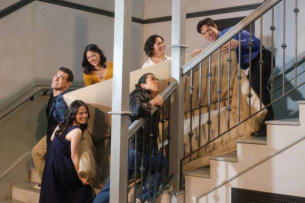 Guests recreating the iconic pivot scene at The FRIENDS Experience: The One In Singapore