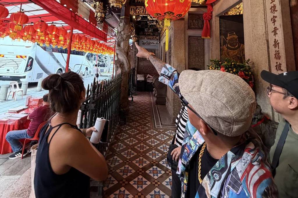 Alvin Chiong pointing to the streets of Chinatown