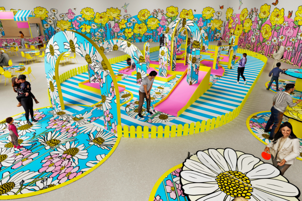 A shot of Bloomyard by Graphic Rewilding's garden mini-golf course, featuring a vibrant display of blooms on display at IMBA