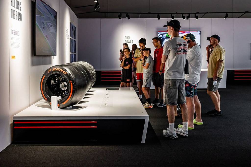 Formula 1 drivers showcase with people looking at it 
