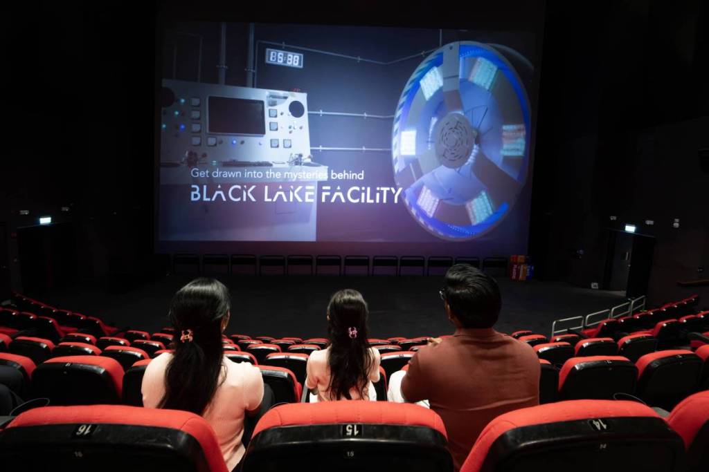 A family enjoying the immersive iWERKS theatre, Singapore's largest flat-screen theatre on display at the Singapore Discovery Centre, part of the Defence Collective Singapore