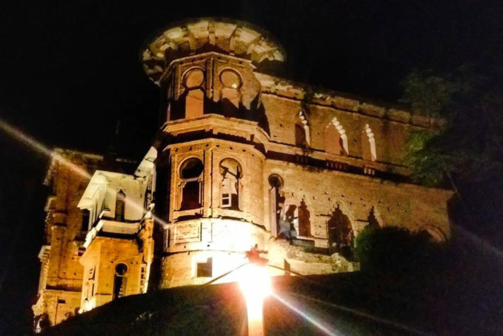 haunted mansion in the Malaysian jungle at night known for secret tunnels
