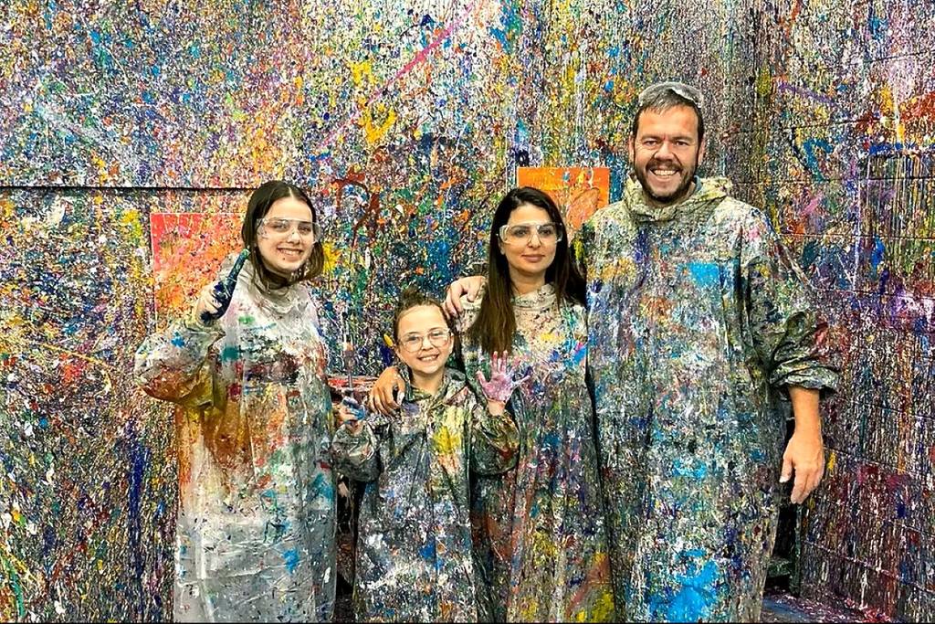 people covered in paint spritz