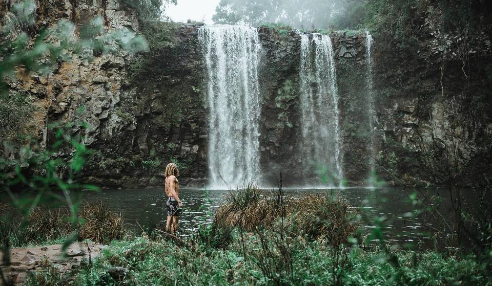 The Prettiest Waterfall In NSW Drops Into A Crystal-Clear Pool Surrounded By Lush Rainforests – Perfect For Summer