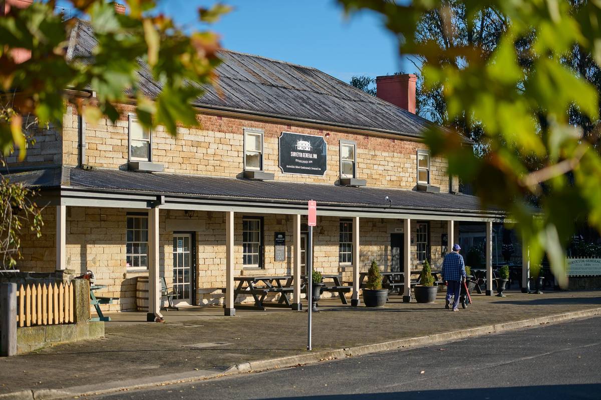 The PepperGreen Estate in Berrima, a historic stone building with outdoor seating