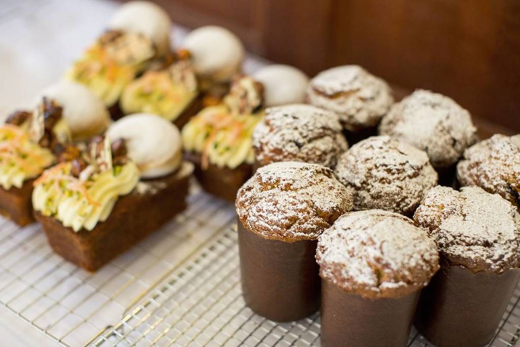 Freshly baked cakes and muffins dusted with icing sugar at Old Mill Cafe in Millthorpe, NSW