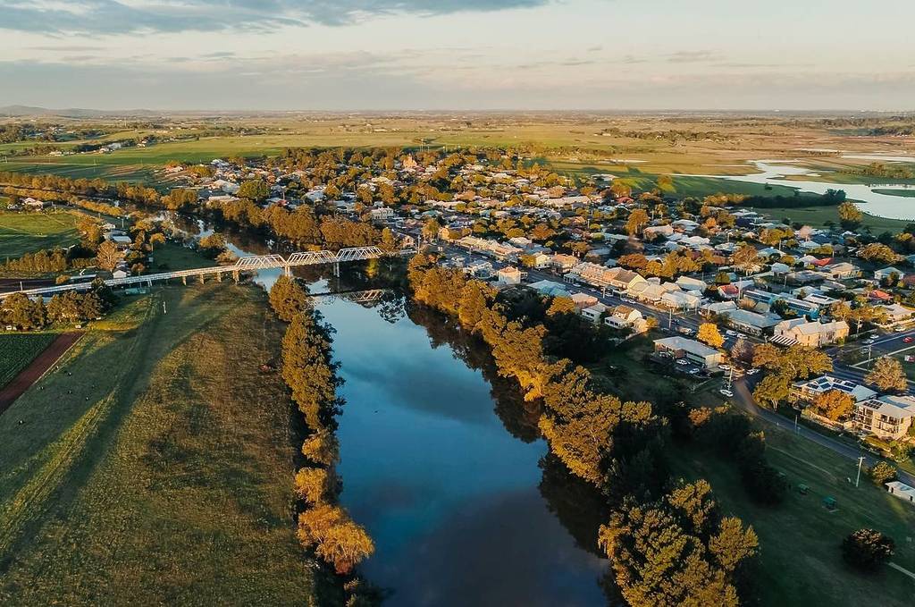 Aerial view of Morpeth, one of the best weekend trips in NSW, surrounded by lush greenery and fields, capturing a peaceful rural landscape