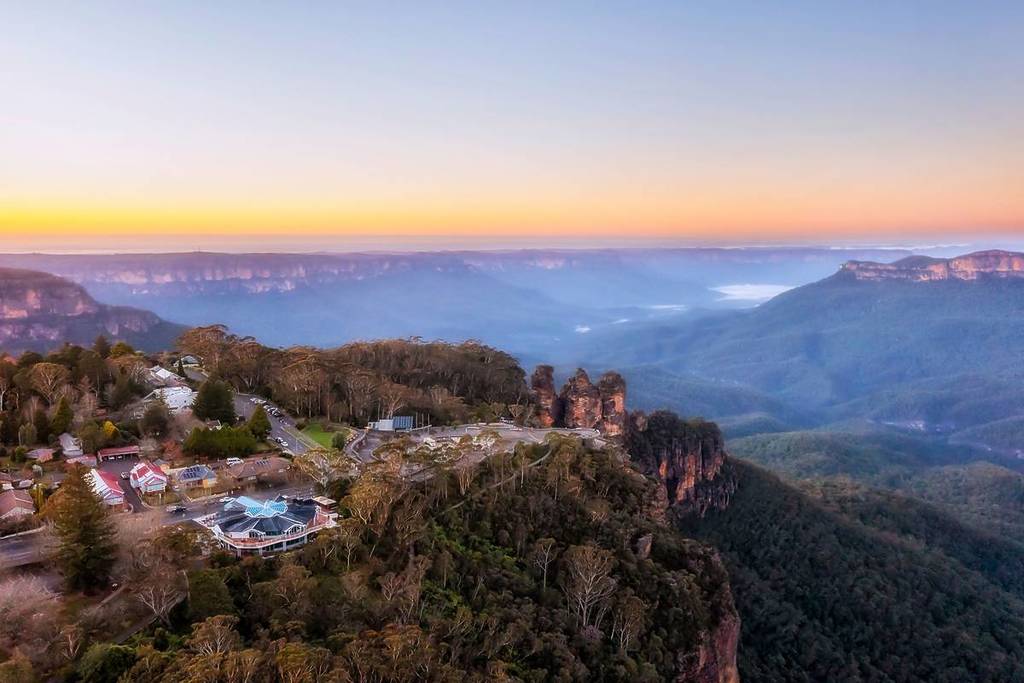 Aerial view of the Three Sisters at sunrise, overlooking the Blue Mountains and Jamison Valley in Katoomba, NSW