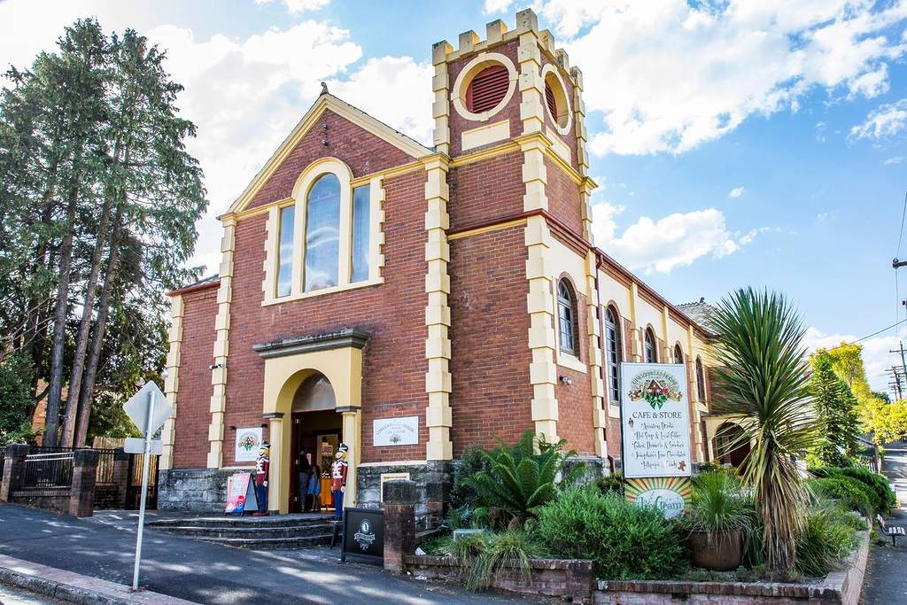 Historic red-brick building in Katoomba, NSW, home to a vintage-style cafe and store on the town’s main street