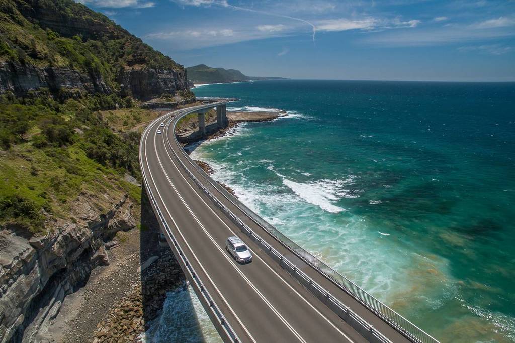The Sea Cliff Bridge along the Grand Pacific Drive, curving over the coastline with turquoise waters below