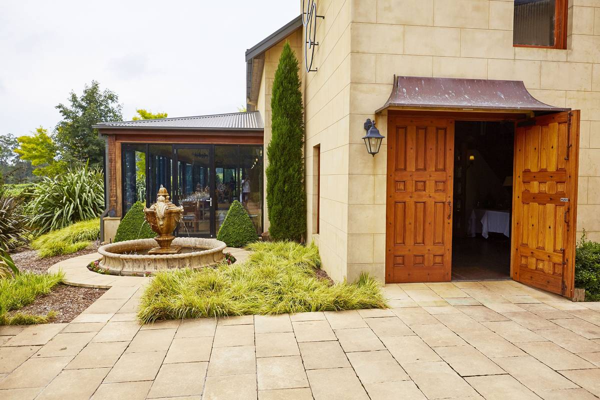 Elegant stone building with a charming courtyard fountain, one of the best fairytale small towns in NSW