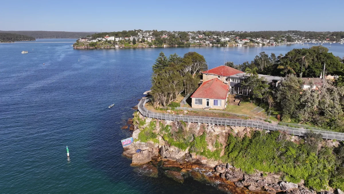 Aerial view of the Hungry Point Clifftop Walk wrapping around the headland, overlooking Port Hacking and surrounding coastline