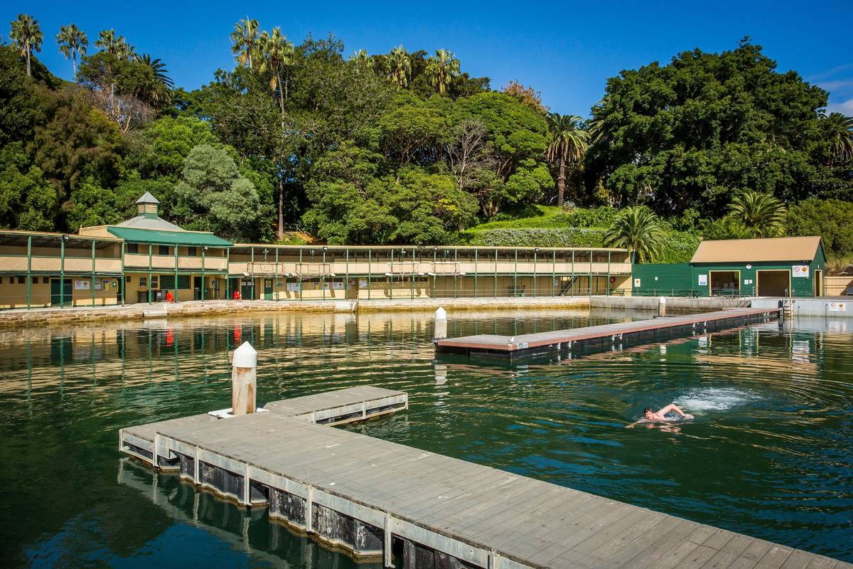 Timber platforms and calm harbour water at Dawn Fraser Baths in Balmain East