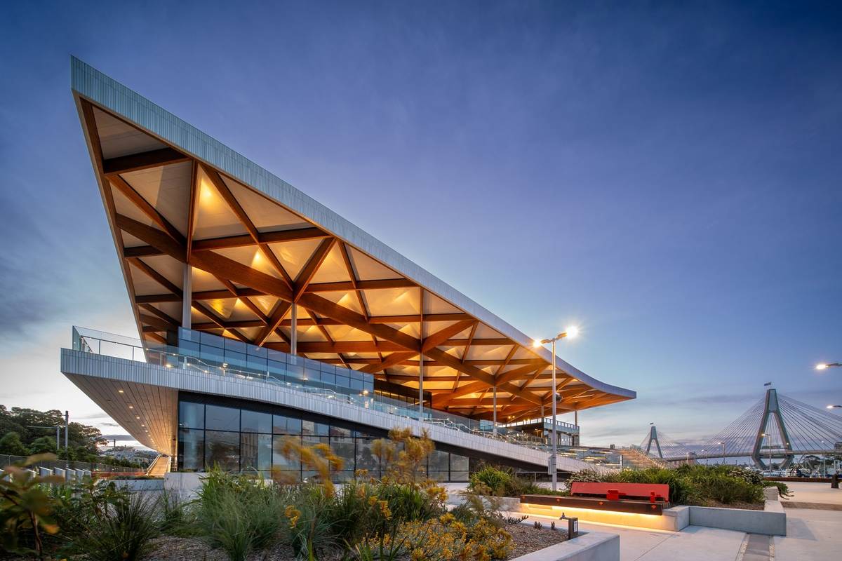Inside the new Sydney Fish Market, showing seafood stalls, shoppers and the timber roof structure