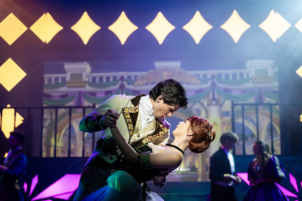 Hans dips Anna while dancing at Frozen: The Musical.