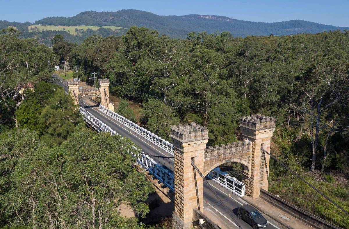 Hampden Bridge in Kangaroo Valley, with historic sandstone towers surrounded by bushland